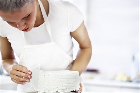 decorating - Woman decorating cake Stock Photo - Premium Royalty-Free, Code: 649-06830171