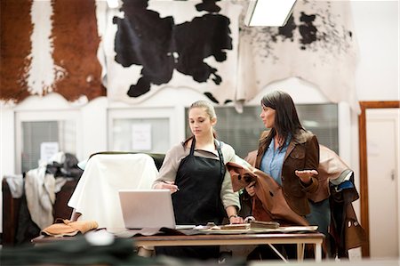 people working at crafts - Worker and customer in leather workshop Stock Photo - Premium Royalty-Free, Code: 649-06844097