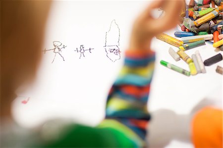 Child drawing with crayons Stock Photo - Premium Royalty-Free, Code: 649-06844151