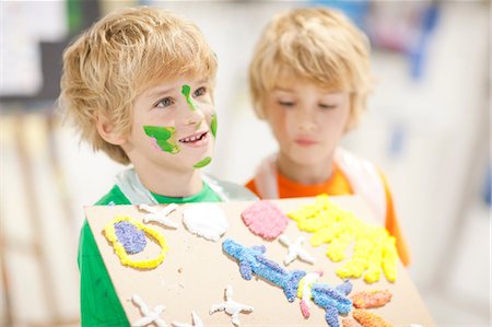 paint children - Boy showing his artistic creation Stock Photo - Premium Royalty-Free, Code: 649-06844178