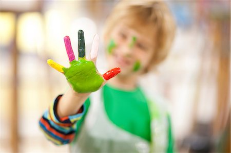 Boy with paint on his hand Stock Photo - Premium Royalty-Free, Code: 649-06844171