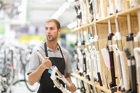 retail industry - Worker in bicycle shop Stock Photo - Premium Royalty-Free, Code: 649-06844217
