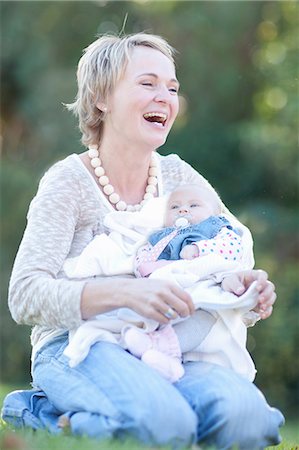 Mother holding baby daughter, laughing Stock Photo - Premium Royalty-Free, Code: 649-06844300