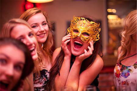 simsearch:649-06844392,k - Young woman wearing masquerade mask at hen party Stock Photo - Premium Royalty-Free, Code: 649-06844386