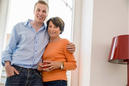 senior woman indoor portraits - Portrait of mother with grown up son Stock Photo - Premium Royalty-Free, Code: 649-06844439