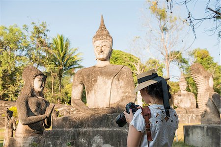 Woman photographing statue, Xieng Khu, Vientiane, Laos Stock Photo - Premium Royalty-Free, Code: 649-06844455