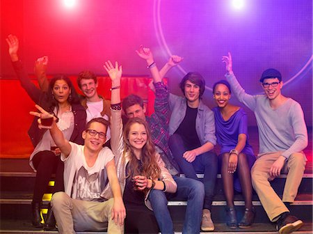 Group of teenagers and young adults at party holding drinks and raising arms Stock Photo - Premium Royalty-Free, Code: 649-06844696