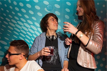 simsearch:649-06844687,k - Teenagers holding drinking glasses Stock Photo - Premium Royalty-Free, Code: 649-06844690