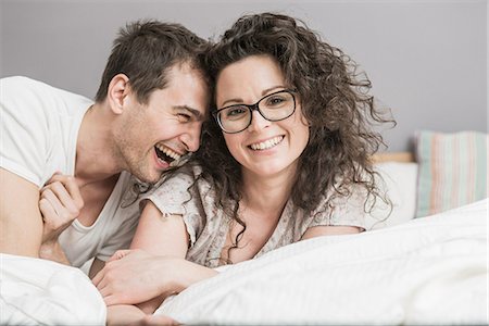 passion - Mid adult woman couple fooling around on bed Stock Photo - Premium Royalty-Free, Code: 649-06844754