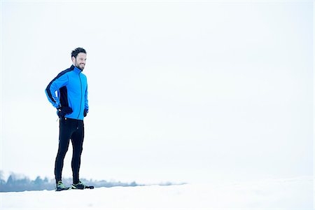 distancia (medición) - Man preparing for snow run Foto de stock - Sin royalties Premium, Código: 649-06844987