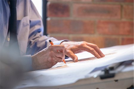 planning - Architect making plans at drawing board, close up Stock Photo - Premium Royalty-Free, Code: 649-06845052