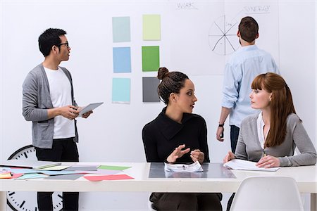 people looking at paperwork - Team working in design studio Stock Photo - Premium Royalty-Free, Code: 649-06845181