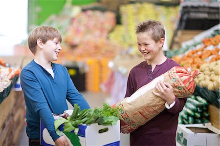 shopper (male) - Young boys carrying vegetables in indoor market Stock Photo - Premium Royalty-Free, Code: 649-07064039
