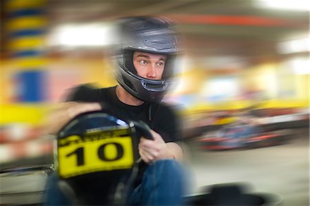 fun adult race - Young man racing in go cart Stock Photo - Premium Royalty-Free, Code: 649-07064096