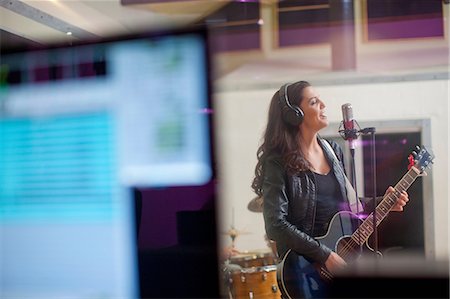 singing photography - Young woman recording in studio Stock Photo - Premium Royalty-Free, Code: 649-07064118