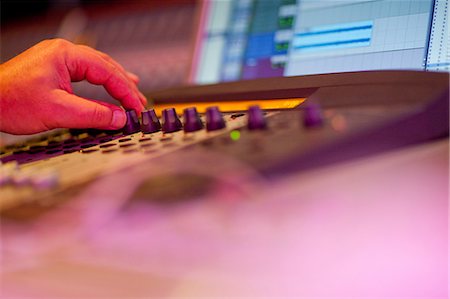 record - Close up of hand on mixing desk Stock Photo - Premium Royalty-Free, Code: 649-07064120