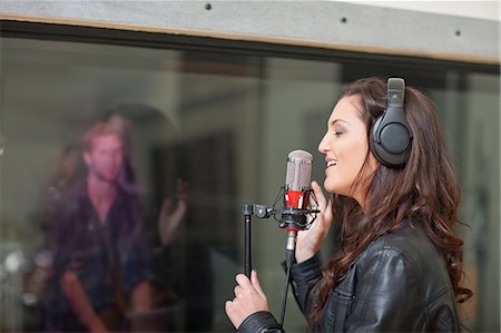 female musicians with long hair - Young female singer in recording studio Stock Photo - Premium Royalty-Free, Code: 649-07064131