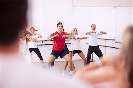 simsearch:649-07064168,k - Class doing aerobic training in gym Stock Photo - Premium Royalty-Free, Code: 649-07064164