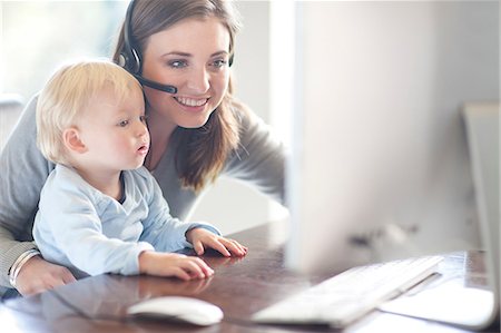 Mother and baby boy looking at computer Stock Photo - Premium Royalty-Free, Code: 649-07064180