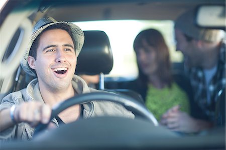 person in car interior - Young adult friends driving in car Stock Photo - Premium Royalty-Free, Code: 649-07064222