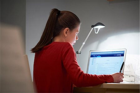 someone sitting at a desk backside - Girl using laptop computer Stock Photo - Premium Royalty-Free, Code: 649-07064284