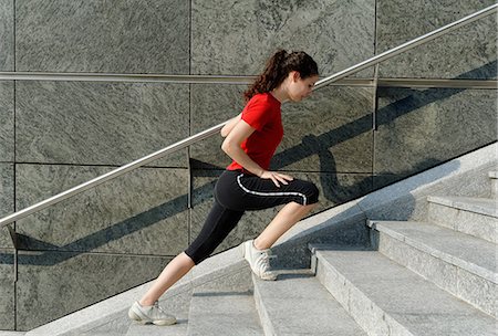 person looking down, city - Young woman training on stairway Stock Photo - Premium Royalty-Free, Code: 649-07064315