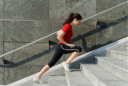 female runner side view - Young woman training on stairway Stock Photo - Premium Royalty-Free, Code: 649-07064315