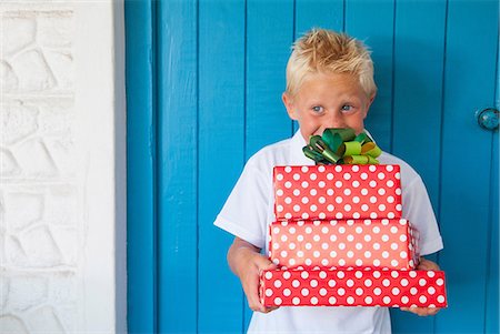 someone standing on a dot - Boy excited at gifts Stock Photo - Premium Royalty-Free, Code: 649-07064409