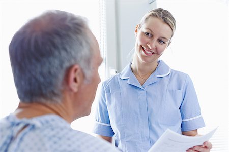registered nurse - Nurse having conversation with patient Stock Photo - Premium Royalty-Free, Code: 649-07064700