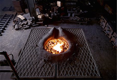 Working in cast iron foundry Foto de stock - Sin royalties Premium, Código: 649-07064867