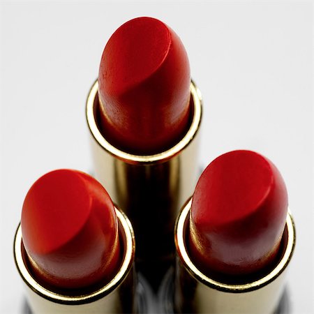 rossetto - Three red lipsticks Fotografie stock - Premium Royalty-Free, Codice: 649-07065001