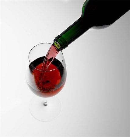 drinks, white background - Pouring red wine into glass Stock Photo - Premium Royalty-Free, Code: 649-07065079