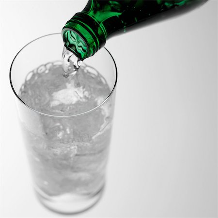 Pouring sparkling water into glass Stock Photo - Premium Royalty-Free, Code: 649-07065073