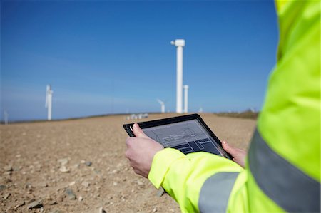 projet - Project manager using digital tablet in front of wind farm Stock Photo - Premium Royalty-Free, Code: 649-07062988