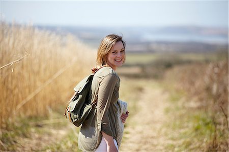 simsearch:614-07031820,k - Portrait of young woman on dirt track next to field of reeds Stockbilder - Premium RF Lizenzfrei, Bildnummer: 649-07063002