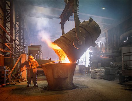 protective clothing - Steel worker and buckets of molten metal in steel foundry Stock Photo - Premium Royalty-Free, Code: 649-07063084