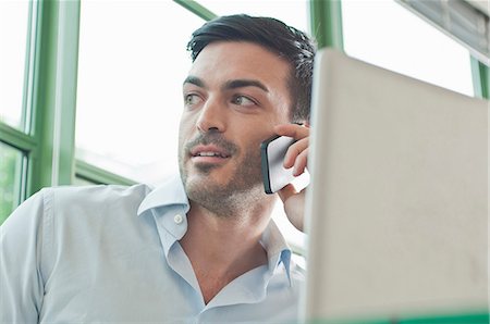 Close up of young male office worker talking on mobile phone Stockbilder - Premium RF Lizenzfrei, Bildnummer: 649-07063124
