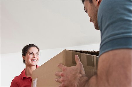 female lift carry female - Young couple with cardboard box Stock Photo - Premium Royalty-Free, Code: 649-07063133