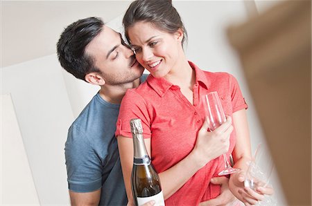 romantic home - Young couple celebrating with champagne Stock Photo - Premium Royalty-Free, Code: 649-07063140