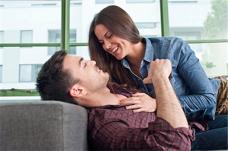 romantic couple in living room - Romantic young couple at home fooling about Stock Photo - Premium Royalty-Free, Code: 649-07063172