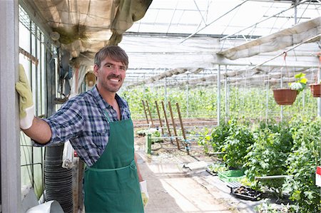 Portrait of organic farmer in greenhouse Foto de stock - Sin royalties Premium, Código: 649-07063416