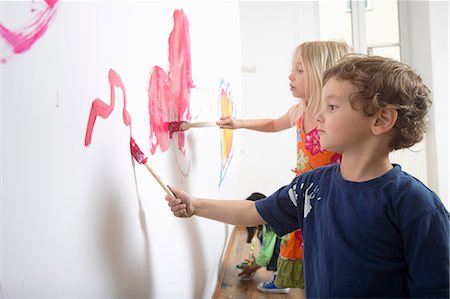 painting in interior - Group of children painting wall Stock Photo - Premium Royalty-Free, Code: 649-07063459