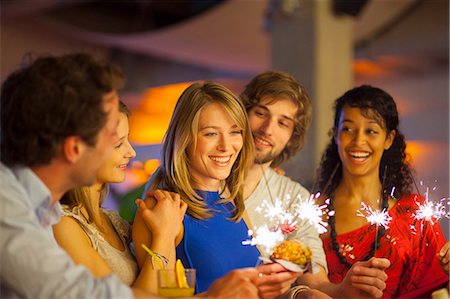 sharing umbrella - Group of friends enjoying cocktails in bar Stock Photo - Premium Royalty-Free, Code: 649-07063518