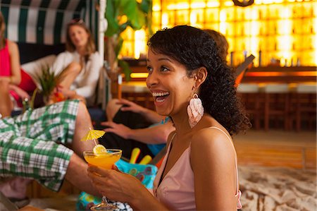 sharing umbrella - Friends enjoying cocktails in bar Stock Photo - Premium Royalty-Free, Code: 649-07063529