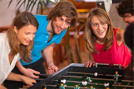 simsearch:649-07063559,k - Close up of friends having fun playing table football Stockbilder - Premium RF Lizenzfrei, Bildnummer: 649-07063555