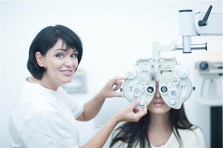 patient happy - Young woman having eyes tested Stock Photo - Premium Royalty-Free, Code: 649-07063764