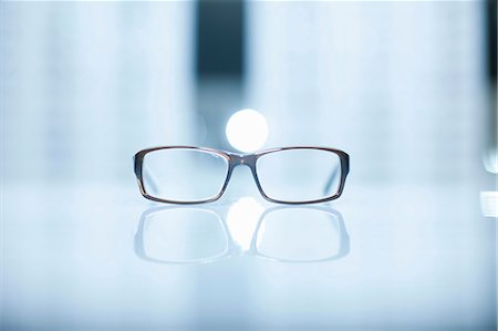 eyeglasses not sunglasses - A pair of lone eyeglasses Stock Photo - Premium Royalty-Free, Code: 649-07063805