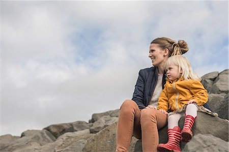 family life - Mother and toddler sitting on harbor wall Stock Photo - Premium Royalty-Free, Code: 649-07063826