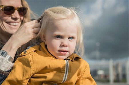 simsearch:649-07063832,k - Outdoor portrait of mother braiding toddlers hair Stock Photo - Premium Royalty-Free, Code: 649-07063820