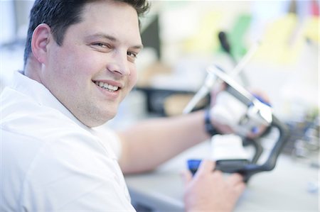 dental technician - Portrait of dental technician working in lab Stock Photo - Premium Royalty-Free, Code: 649-07063858